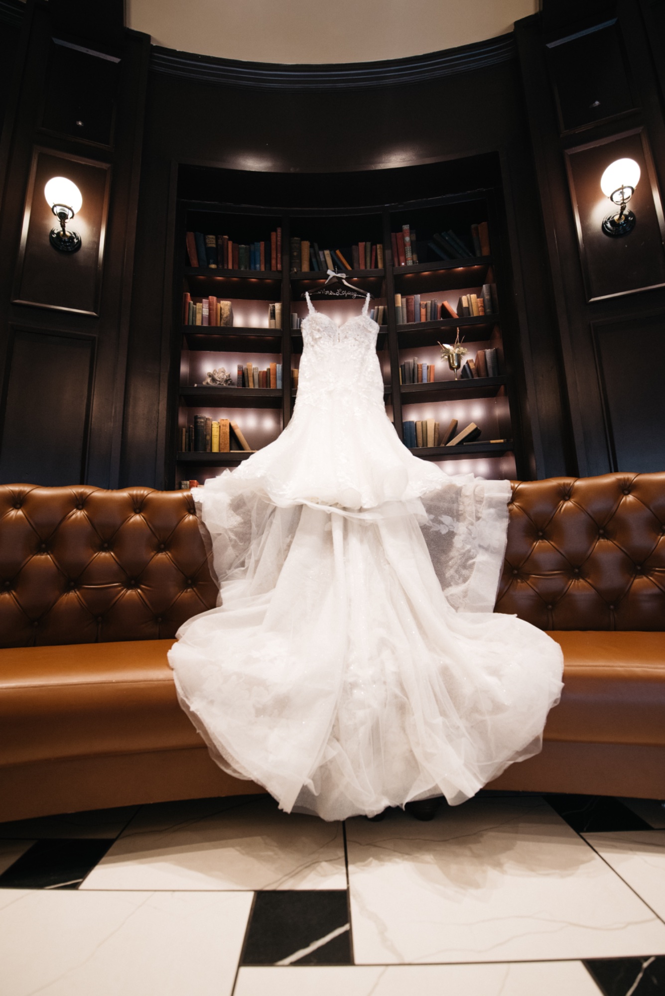 Wedding dress on library bookshelf